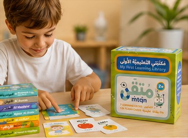 A child learning with flashcards at a table