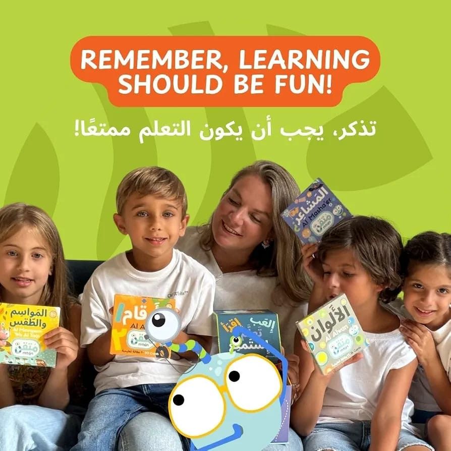 A parent and children laughing with the flashcards